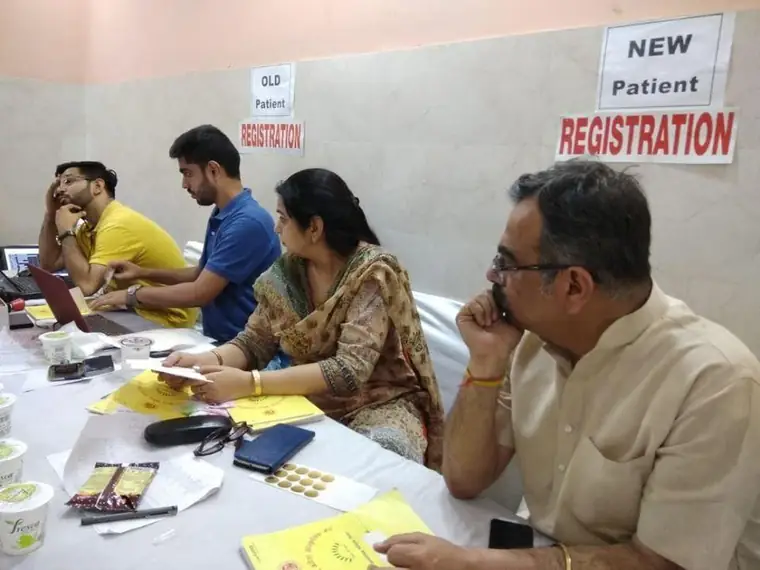 Volunteers at the new patient registration desk