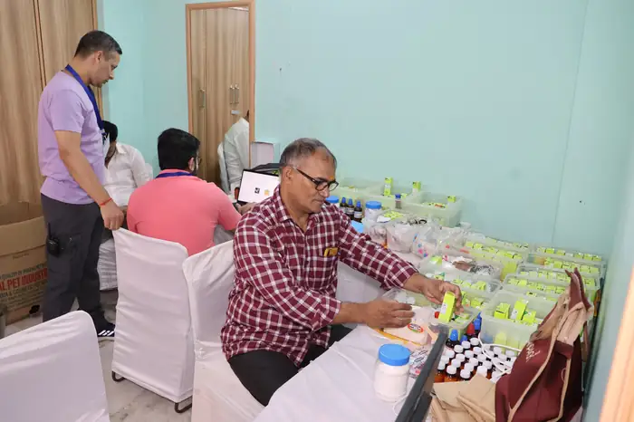 Volunteers handing out free medicines at the dispensing counter
