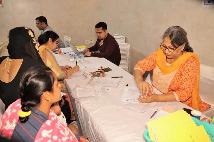 Volunteers registering families at the reception desk